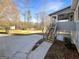 Backyard view showcasing the patio, grassy area and entry to screened porch at 1280 Pinyon Pl, Lawrenceville, GA 30043