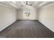 Large bedroom with tray ceilings, neutral walls, carpet, and large window for ample light at 1280 Pinyon Pl, Lawrenceville, GA 30043