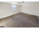 Bedroom with neutral carpet, a window for natural light, and ample space for furniture at 1280 Pinyon Pl, Lawrenceville, GA 30043