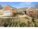Charming brick home with attached garage and well-maintained lawn and minimal landscaping at 1280 Pinyon Pl, Lawrenceville, GA 30043