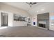 Spacious living room showcasing a fireplace and open layout to the kitchen, ideal for entertaining at 1280 Pinyon Pl, Lawrenceville, GA 30043