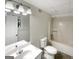Cozy bathroom with a single sink vanity, toilet, and a shower-tub combination at 1280 Pinyon Pl, Lawrenceville, GA 30043