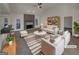 Bright living room featuring a fireplace, neutral decor, plush seating, and a modern ceiling fan at 1280 Pinyon Pl, Lawrenceville, GA 30043