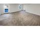 Finished basement with a door to the outside and neutral carpet, allowing easy outdoor access at 1280 Pinyon Pl, Lawrenceville, GA 30043