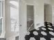 The primary bathroom has an adjoining walk-in closet, with carpet flooring and shelving at 1280 Pinyon Pl, Lawrenceville, GA 30043