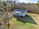 Aerial view of a charming home with a well-maintained lawn and beautiful surroundings at 550 Stateline Rd, Bowdon, GA 30108