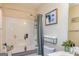 Bright bathroom with a shower-over-tub, neutral walls, and modern fixtures at 550 Stateline Rd, Bowdon, GA 30108