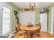 Cozy dining area featuring a round wooden table, chairs, and natural lighting at 550 Stateline Rd, Bowdon, GA 30108