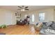 Open-concept living room featuring laminate floors, ample seating, and neutral wall colors at 550 Stateline Rd, Bowdon, GA 30108