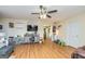 Bright living room with hardwood floors, ceiling fan, and plenty of natural light at 550 Stateline Rd, Bowdon, GA 30108