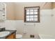 This bathroom offers a classic design with white tile walls and a vanity at 160 Pine Trail Rd, Fayetteville, GA 30214