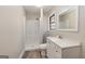 Modern bathroom featuring a vanity, mirror, and a step-in shower, all in a neutral color scheme at 160 Pine Trail Rd, Fayetteville, GA 30214