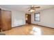 Spacious bedroom with hardwood floors, and ceiling fan, and doorway to the bathroom at 160 Pine Trail Rd, Fayetteville, GA 30214