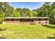 Charming one-story brick home with a well-maintained lawn, offering a classic and inviting curb appeal at 160 Pine Trail Rd, Fayetteville, GA 30214