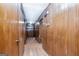 View of hallway with wood paneled walls and doors at 160 Pine Trail Rd, Fayetteville, GA 30214