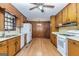 Bright kitchen with light hardwood floors, stainless steel appliances, and plenty of cabinet space at 160 Pine Trail Rd, Fayetteville, GA 30214