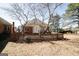 A spacious backyard with a wooden fence providing privacy at 1800 Stockton Walk Ln, Snellville, GA 30078