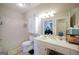 Standard bathroom featuring a tub with shower, vanity, and a large mirror at 1800 Stockton Walk Ln, Snellville, GA 30078