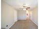Spacious carpeted bedroom with a ceiling fan and bathroom view, perfect for relaxation and comfort at 1800 Stockton Walk Ln, Snellville, GA 30078