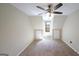 An empty bedroom space with a ceiling fan, carpet, and a window in the back at 1800 Stockton Walk Ln, Snellville, GA 30078