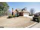 Beautiful home with a manicured lawn and a two-car garage at 1800 Stockton Walk Ln, Snellville, GA 30078