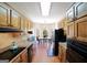 Traditional kitchen featuring wood cabinets, stone countertops, and an eat-in area with natural light at 1800 Stockton Walk Ln, Snellville, GA 30078