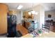 Bright kitchen area with wood cabinets, black appliances, eat-in table and hardwood flooring at 1800 Stockton Walk Ln, Snellville, GA 30078
