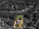 Aerial view of neighborhood and the surrounding mature tree coverage and nearby golf course at 925 Champions Way, Mcdonough, GA 30252