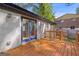 Cozy back deck with blue double doors, wood railing and fence, and greenery at 859 Kings Grant Nw Dr, Atlanta, GA 30318