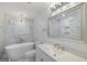 Elegant bathroom with marble tiling, soaking tub, and modern fixtures at 859 Kings Grant Nw Dr, Atlanta, GA 30318