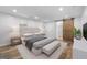 Modern bedroom featuring stylish barn door entrance to an ensuite bathroom at 859 Kings Grant Nw Dr, Atlanta, GA 30318