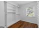 Bright, empty walk-in closet with custom shelving provides ample storage space at 859 Kings Grant Nw Dr, Atlanta, GA 30318