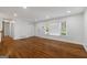 Spacious living room with hardwood floors, large windows and a neutral color palette at 859 Kings Grant Nw Dr, Atlanta, GA 30318