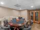 Finished basement game room with large poker table and custom cabinet at 8531 N Shore Dr, Jonesboro, GA 30236