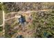 Aerial view of a house nestled among trees, showcasing its serene and private setting at 172 Sam Solomon Rd, Locust Grove, GA 30248