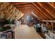 Spacious attic for storage with exposed beams and insulation at 172 Sam Solomon Rd, Locust Grove, GA 30248