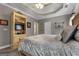 Spacious primary bedroom featuring trey ceiling, ensuite access, and a lovely light fixture at 172 Sam Solomon Rd, Locust Grove, GA 30248