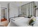 Well-lit bedroom with a bed, walk-in closet, and a cozy atmosphere at 172 Sam Solomon Rd, Locust Grove, GA 30248