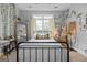 Charming bedroom featuring window, neutral paint, carpet and stylish décor elements at 172 Sam Solomon Rd, Locust Grove, GA 30248