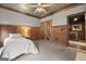 Bedroom with natural wood details, white bedding, and an attached on-suite at 172 Sam Solomon Rd, Locust Grove, GA 30248