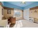 A well-lit bedroom with neutral carpet, sewing table, large window, and ample closet space at 172 Sam Solomon Rd, Locust Grove, GA 30248