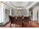 Traditional dining room with a wooden table, leather chairs, and decorative accents at 172 Sam Solomon Rd, Locust Grove, GA 30248