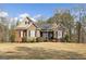 Charming brick and stone home with well-maintained landscaping and a welcoming front entrance at 172 Sam Solomon Rd, Locust Grove, GA 30248