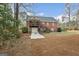 A shot of the exterior featuring a two-story brick home with a spacious backyard at 172 Sam Solomon Rd, Locust Grove, GA 30248