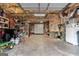 Spacious garage featuring ample storage, concrete floors, and a large garage door at 172 Sam Solomon Rd, Locust Grove, GA 30248