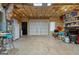 Spacious garage featuring ample storage, concrete floors, and a large garage door at 172 Sam Solomon Rd, Locust Grove, GA 30248