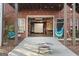 Inviting backyard featuring an open garage, comfortable swing, and outdoor seating at 172 Sam Solomon Rd, Locust Grove, GA 30248