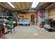 Organized garage featuring a work bench, storage shelves, and plenty of open floor space at 172 Sam Solomon Rd, Locust Grove, GA 30248