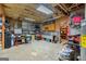 Well-equipped garage featuring a large work bench, storage shelves, and ample room for projects at 172 Sam Solomon Rd, Locust Grove, GA 30248