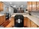 Kitchen featuring wooden cabinets, quartz countertops and seamlessly opening up to the Gathering room at 172 Sam Solomon Rd, Locust Grove, GA 30248